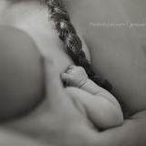 In a series of images that capture the connection and bliss between breastfeeding mother and child, the sweet babe's hand is clenched blissfully into a fist.