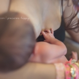 In a series of images that capture the connection and bliss between breastfeeding mother and child, this baby delicately lays his hand on his mother's chest.